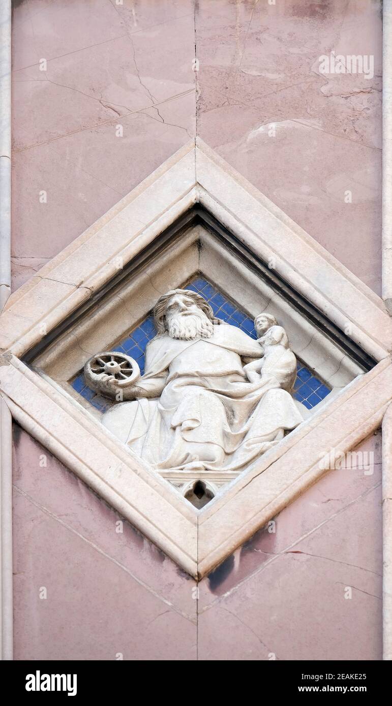Saturn by Collaborator of Andrea Pisano, Relief on Giotto Campanile of Cattedrale di Santa Maria del Fiore (Cathedral of Saint Mary of the Flower), Florence, Italy Stock Photo