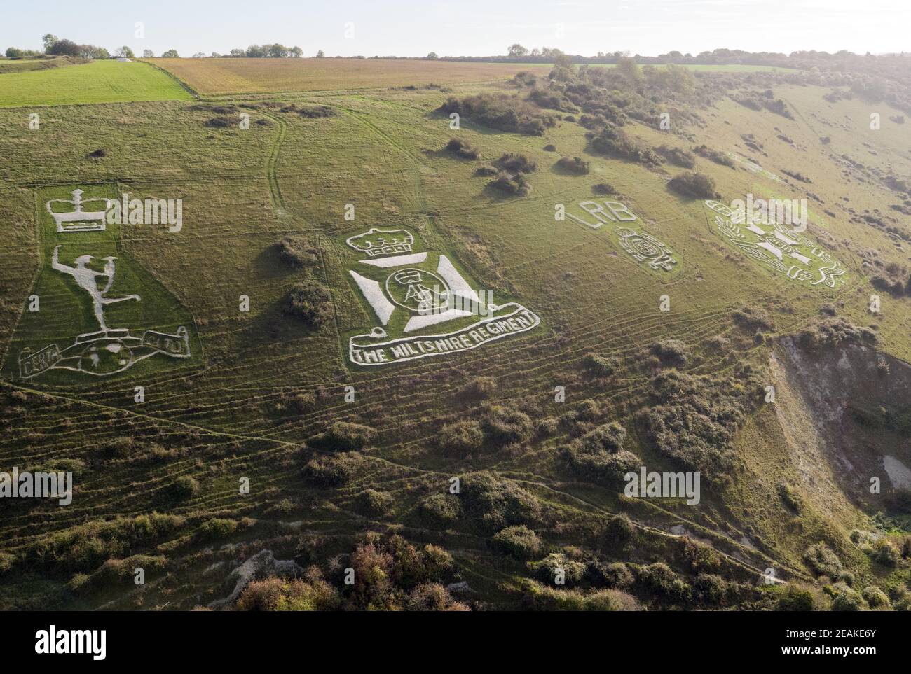 An aerial view of the Fovant Badges in Wiltshire. Many of the regimental badges were cut into the chalk hillside near Fovant by soldiers garrisoned nearby during the First World War. Picture date: Wednesday October 24, 2018. Stock Photo