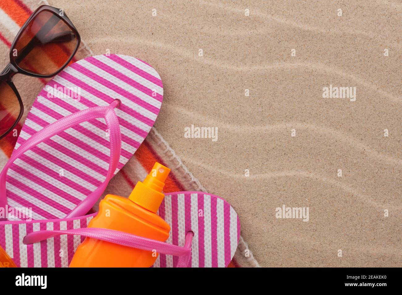 Accessories for the beach lying on the sand Stock Photo