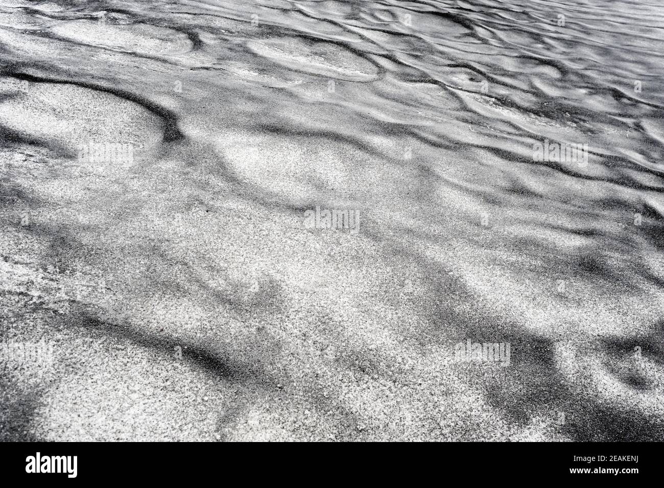 Abstract dirty black texture on white snow. Stock Photo