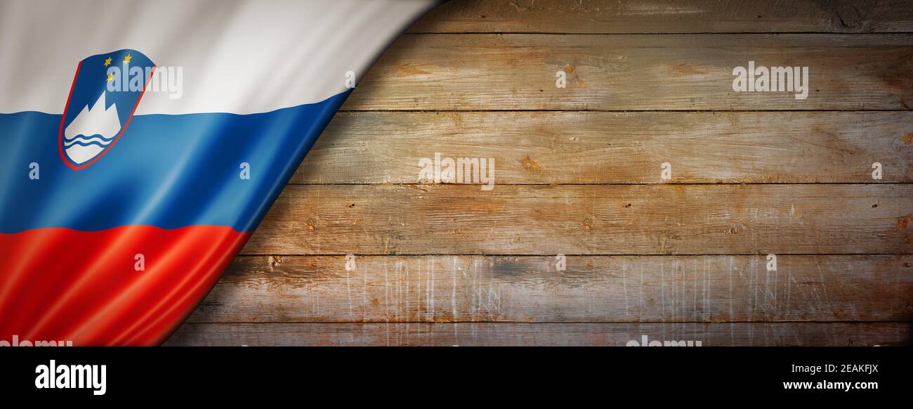 Slovenian flag on vintage wood wall banner Stock Photo - Alamy