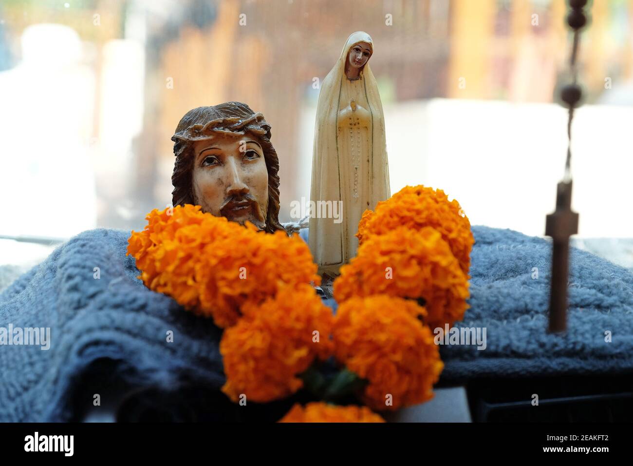 Statue of Jesus Christ and the Virgin Mary on a taxi dashboard in Goa