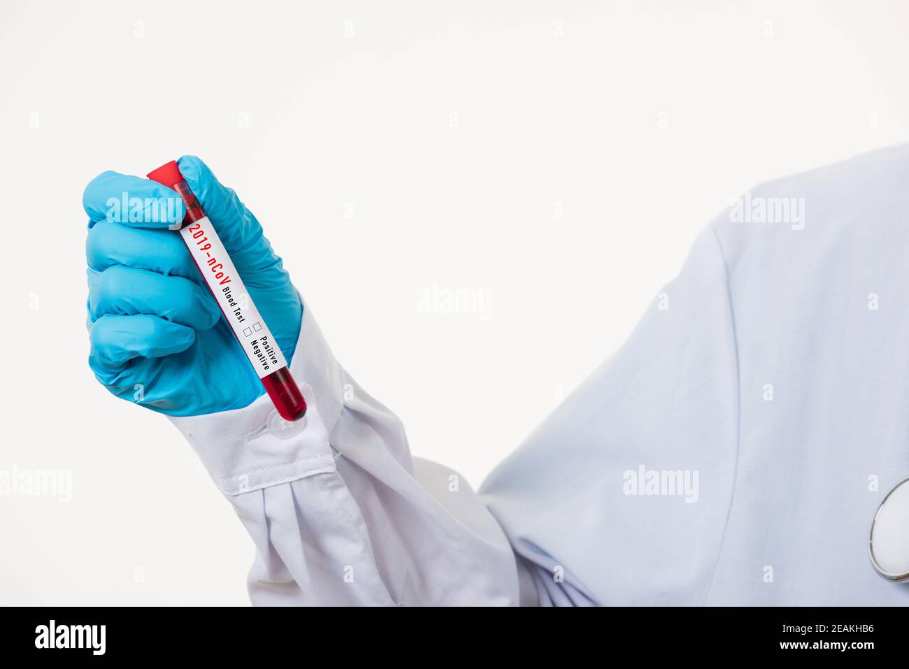 Doctor scientist in white uniform wear a mask holding test tube Coronavirus Stock Photo