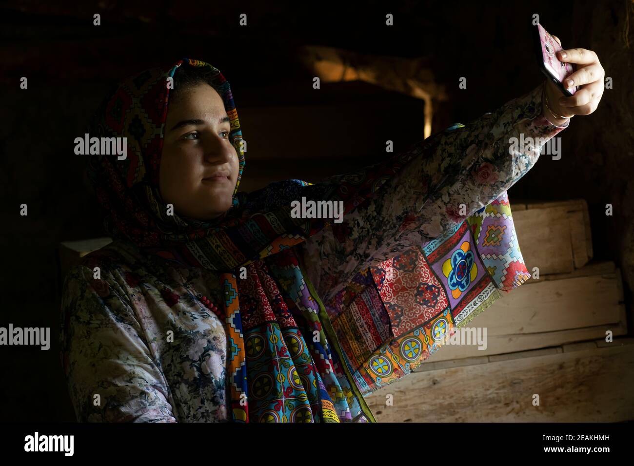 Portrait of an attractive teenage Muslim girl taking a selfi with smart phone Stock Photo