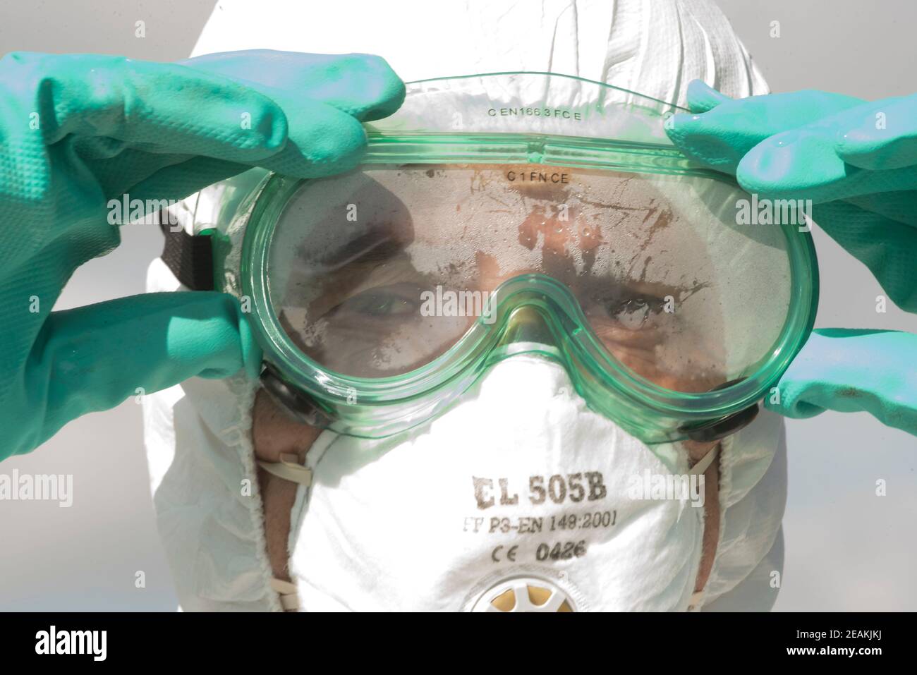 wearing safety goggles at work Stock Photo