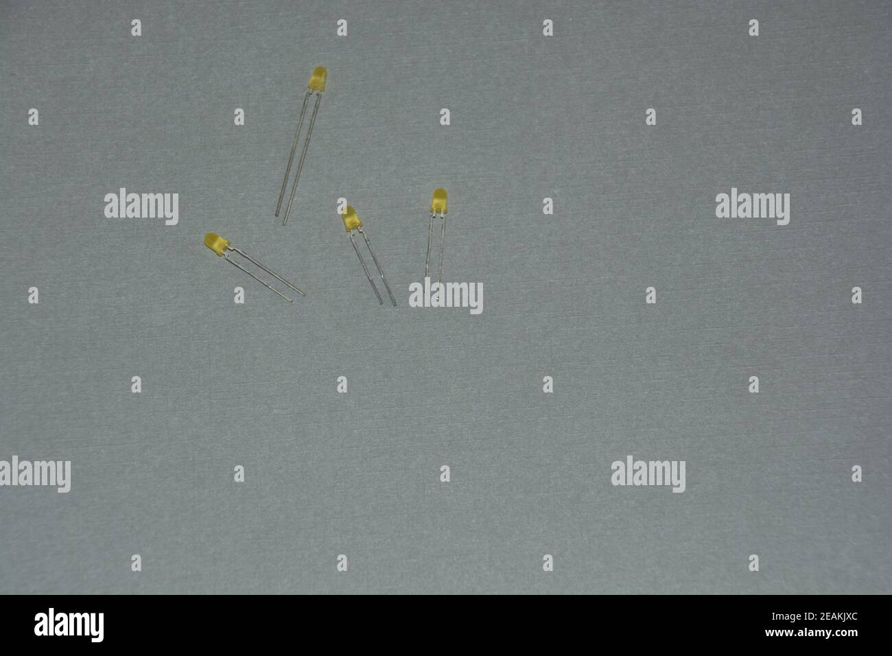 four yellow light emitting diode not connected on grey background Stock Photo