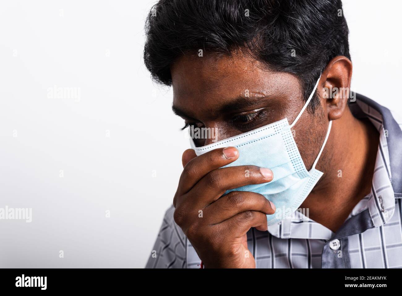 black man wearing surgical hygienic protective cloth face mask against coronavirus he sneeze Stock Photo