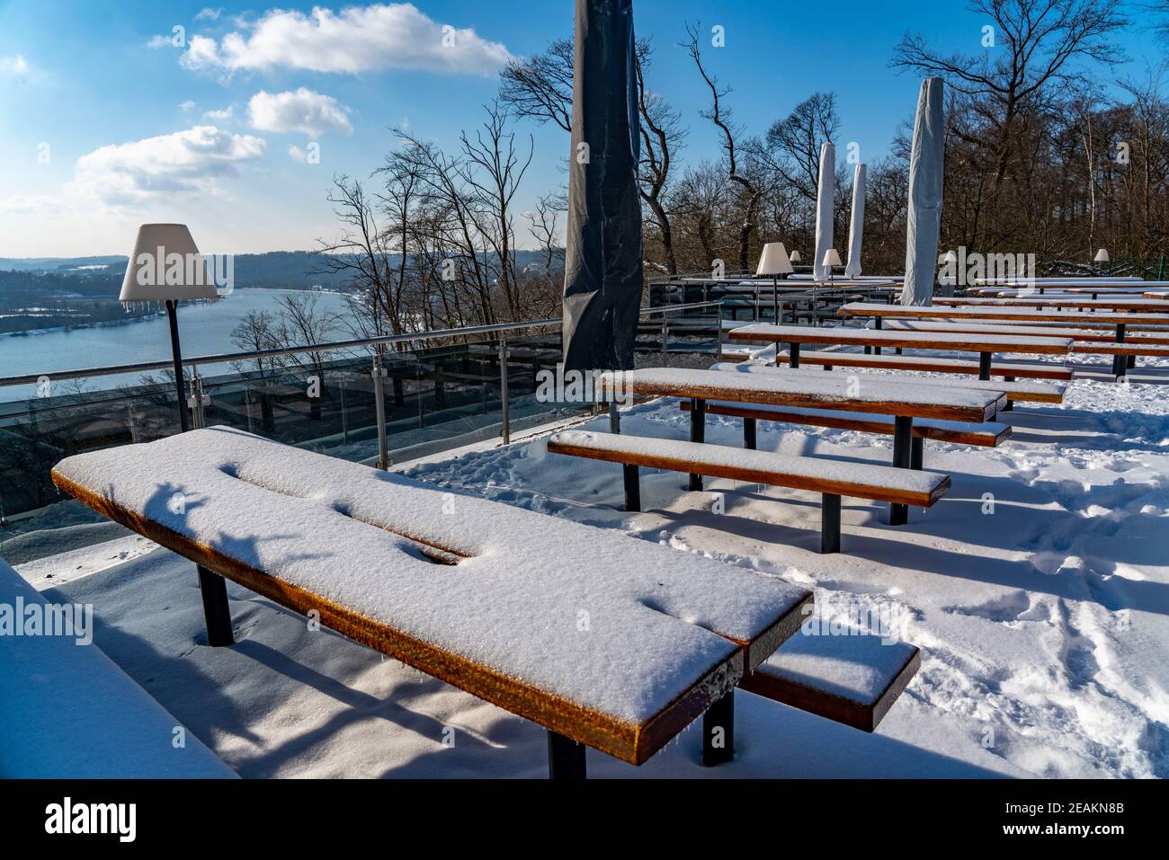 Winter, snowy landscape, restaurant, beer garden terrace, Jagdhaus Schellenberg, with view of Lake Baldeney, Essen, NRW, Germany Stock Photo