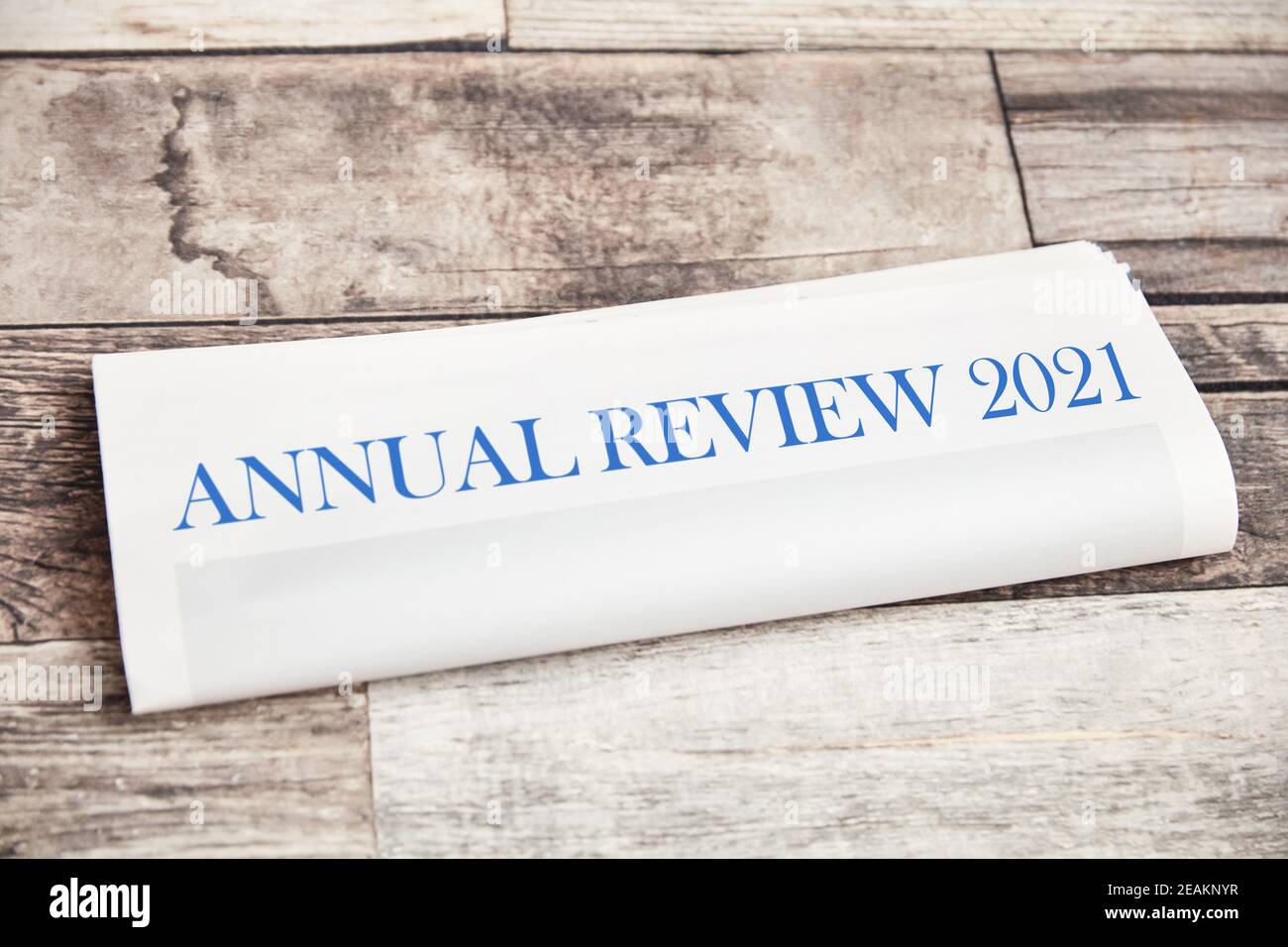 Annual Review 2021 on a folded newspaper as the front page Stock Photo