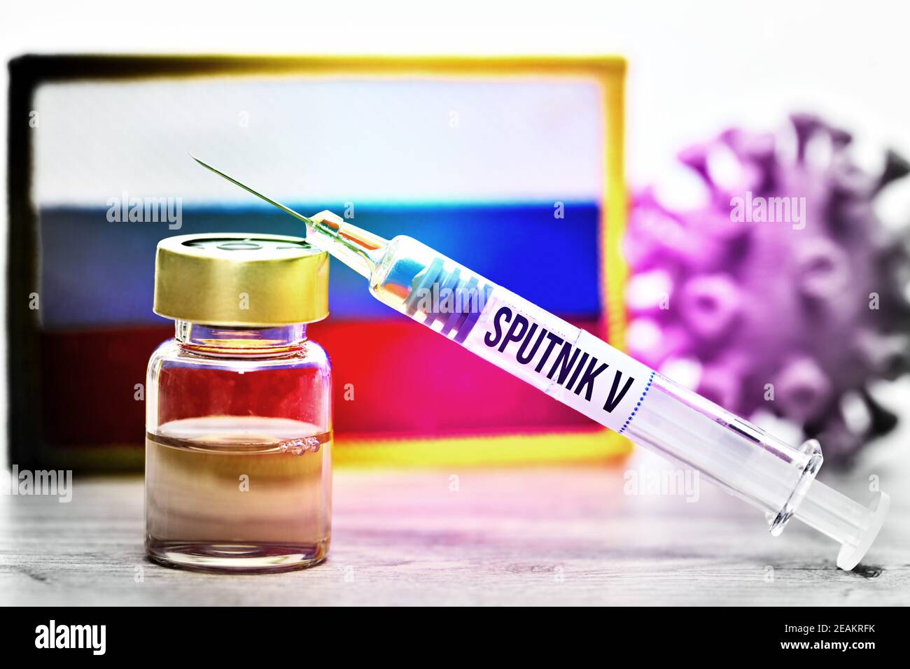 Vaccine Vial, Syringe, Coronavirus Model And Russian Flag, Sputnik V Vaccine Stock Photo