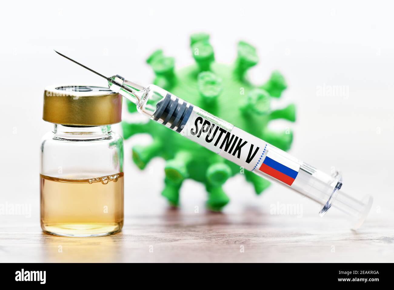 Vaccine Vial, Syringe And Coronavirus Model, Russian Sputnik V Vaccine Stock Photo