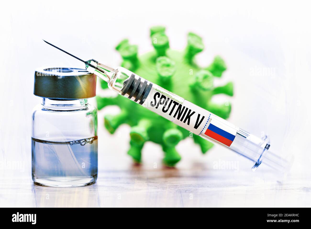 Vaccine Vial, Syringe And Coronavirus Model, Russian Sputnik V Vaccine Stock Photo