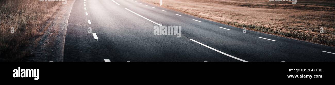 Asphalt road and dividing lines on the street Stock Photo
