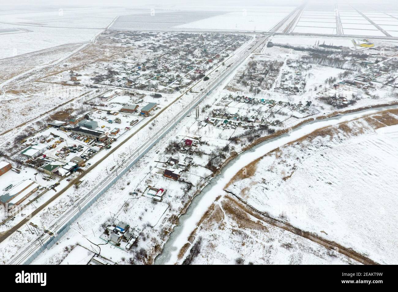 Winter view from the bird's eye view of the village. The streets are covered with snow Stock Photo