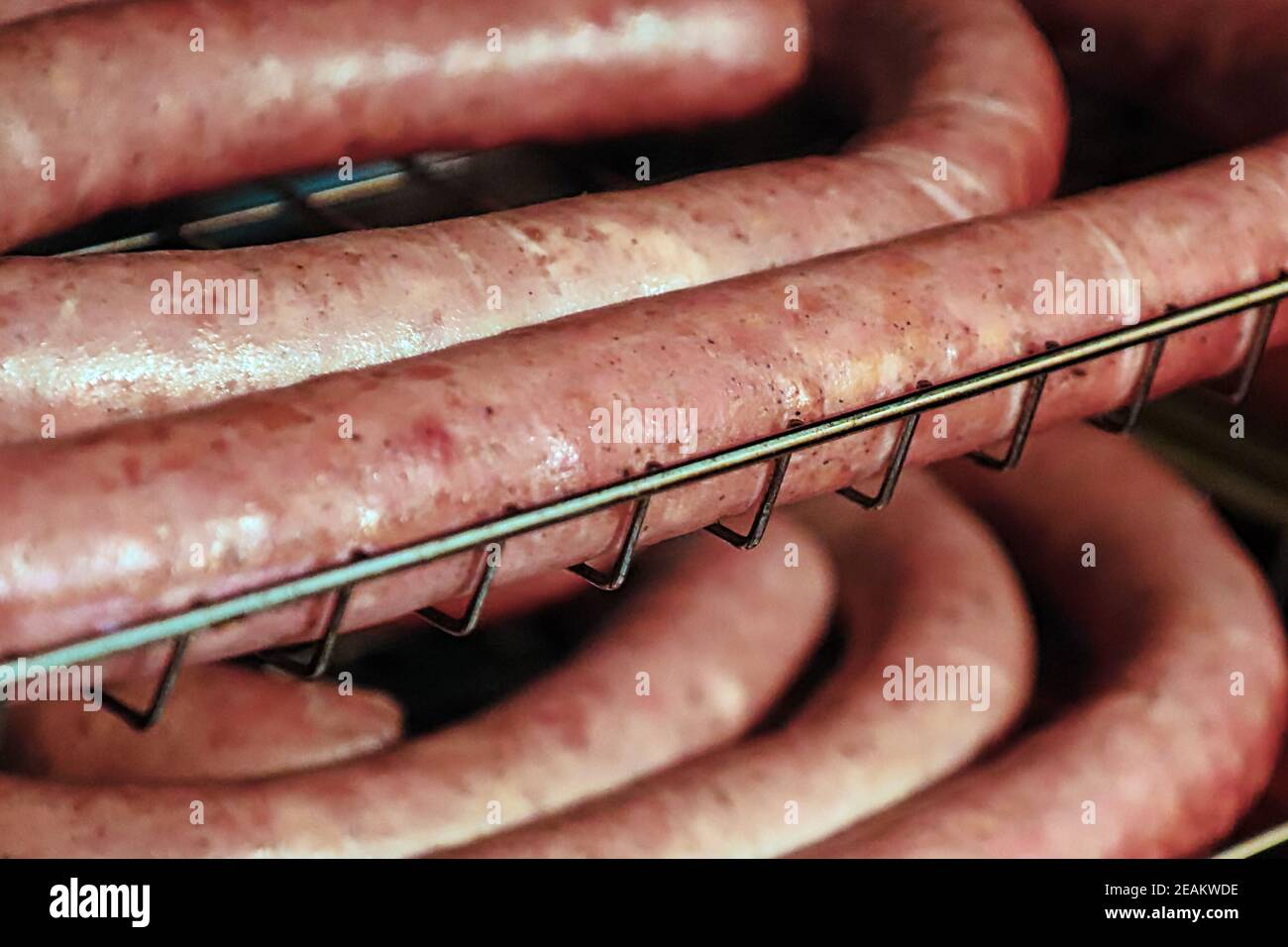Closeup of unsmoked ham sausages on a tray Stock Photo