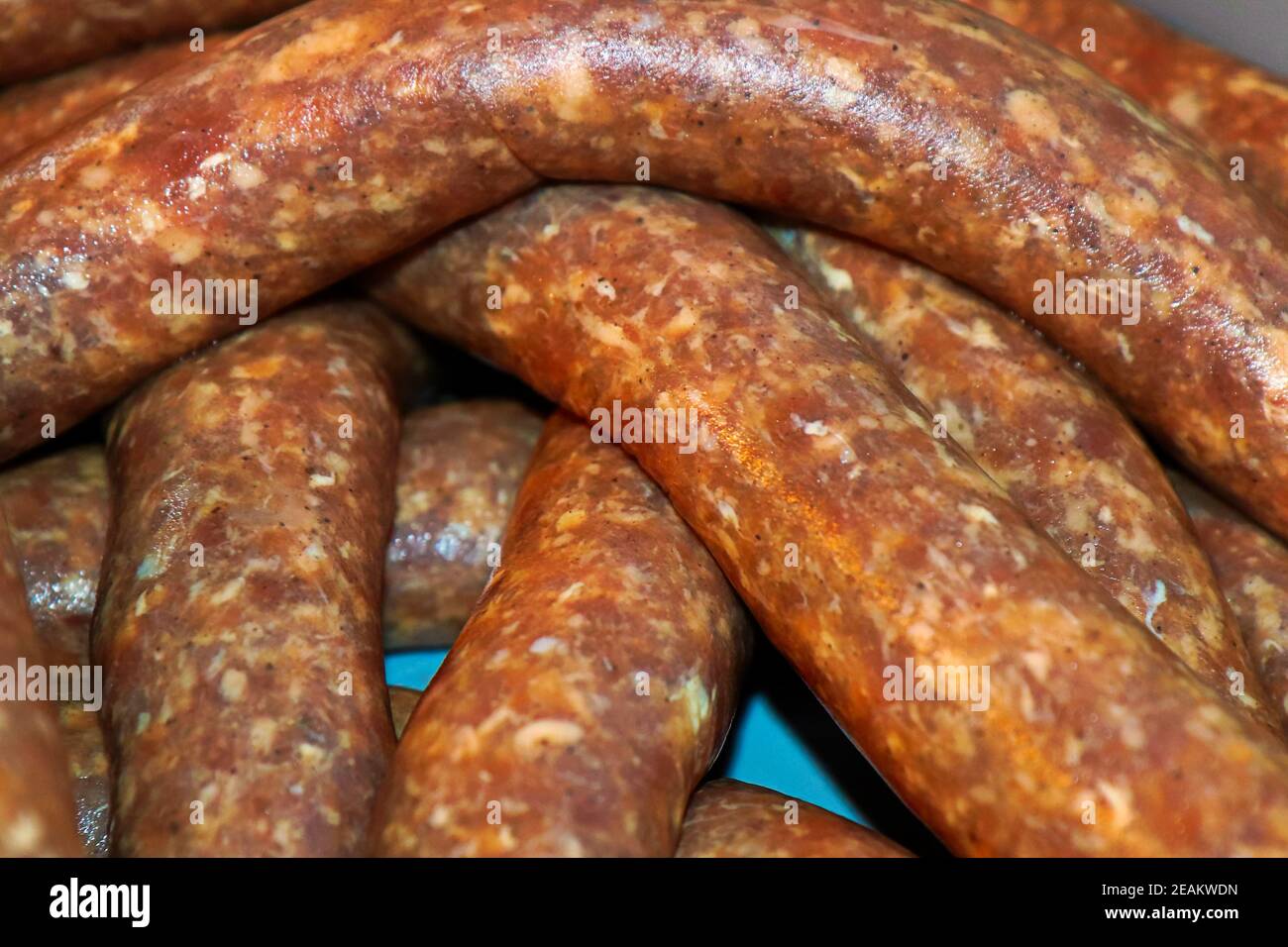 Macro view of raw sausage in a collagen casing Stock Photo