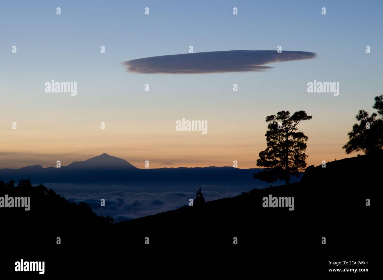Island of Tenerife from Gran Canaria and lenticular cloud. Stock Photo