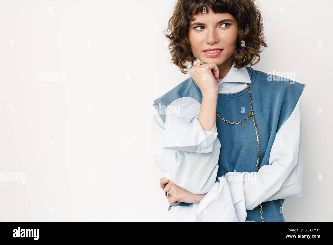 Caucasian beautiful girl posing and looking aside isolated over white ...