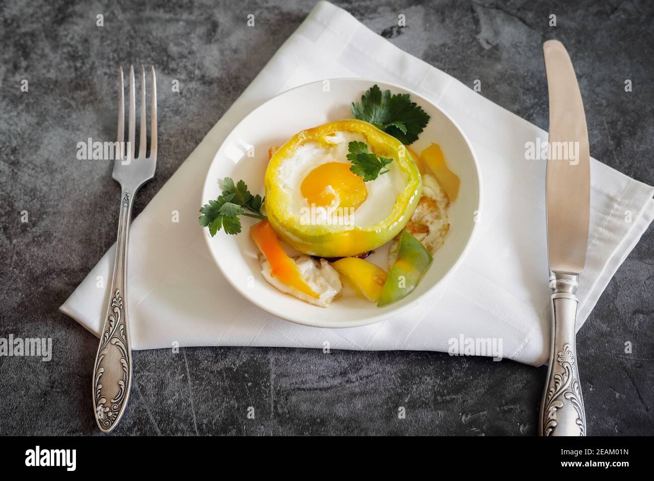 Baked bell pepper with egg inside the pepper Stock Photo Alamy