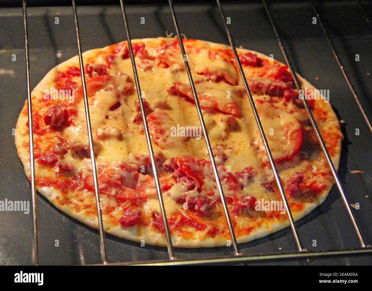 Cook preparing delicious pizza in oven. Cooking fast food in restaurant Stock Photo Alamy