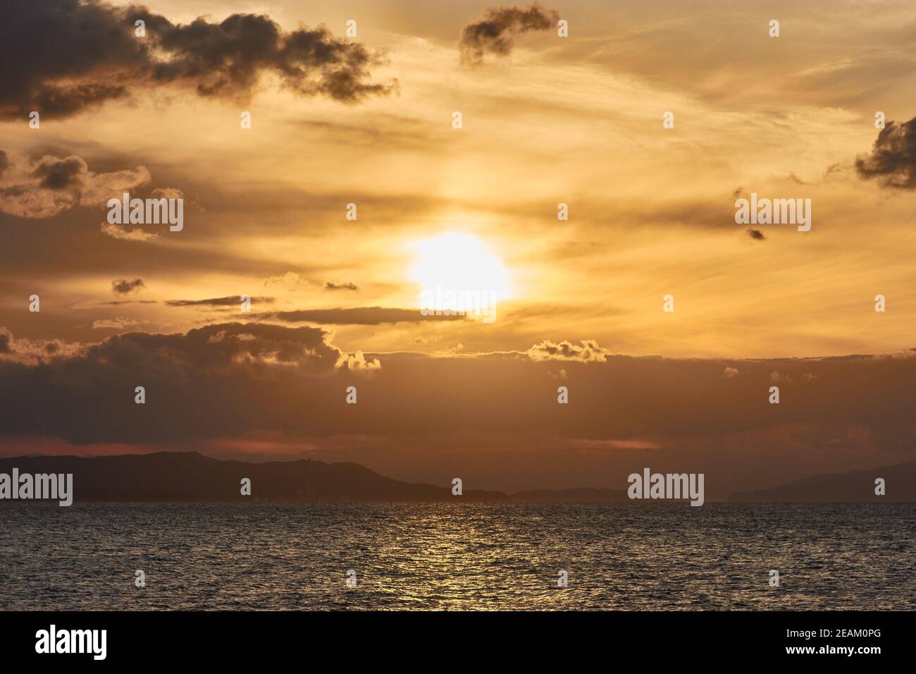 Beautiful scenery of the sunset sky reflecting on a peaceful sea Stock ...