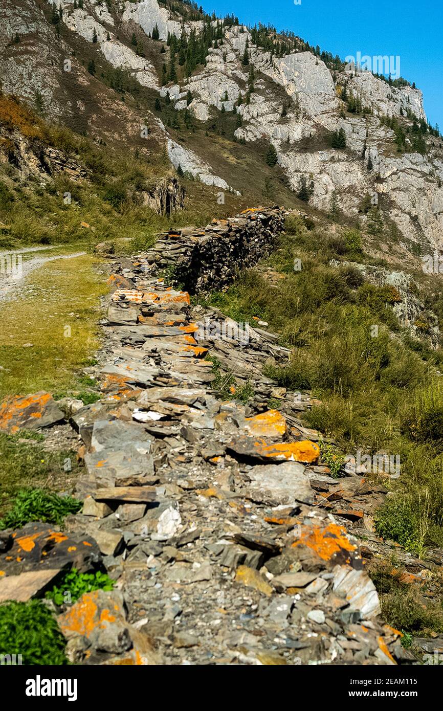 A path made of stones, mountain path in the Altai. Stock Photo