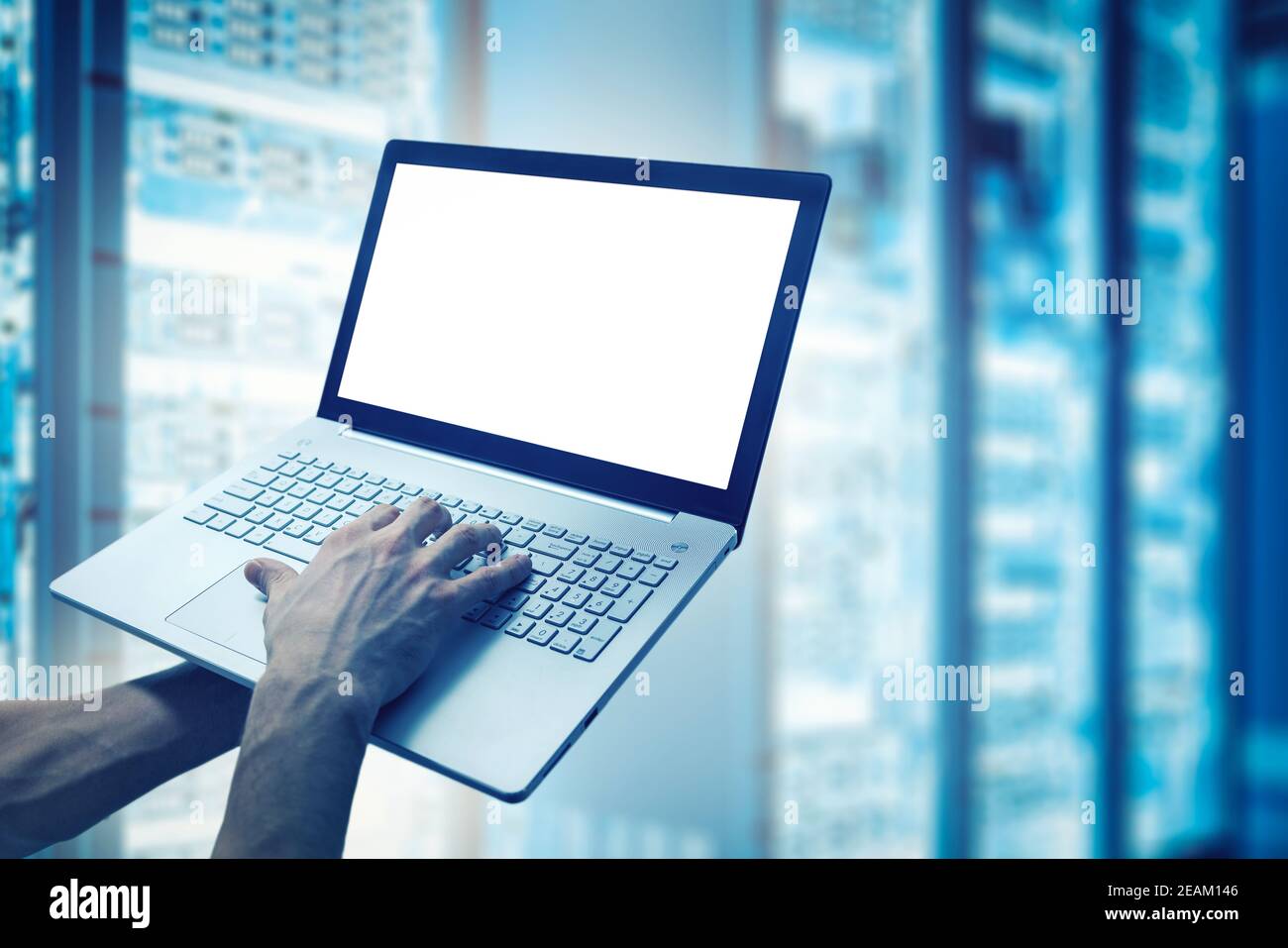 server support and maintenance - network engineer working on laptop in cloud storage data center. mockup Stock Photo