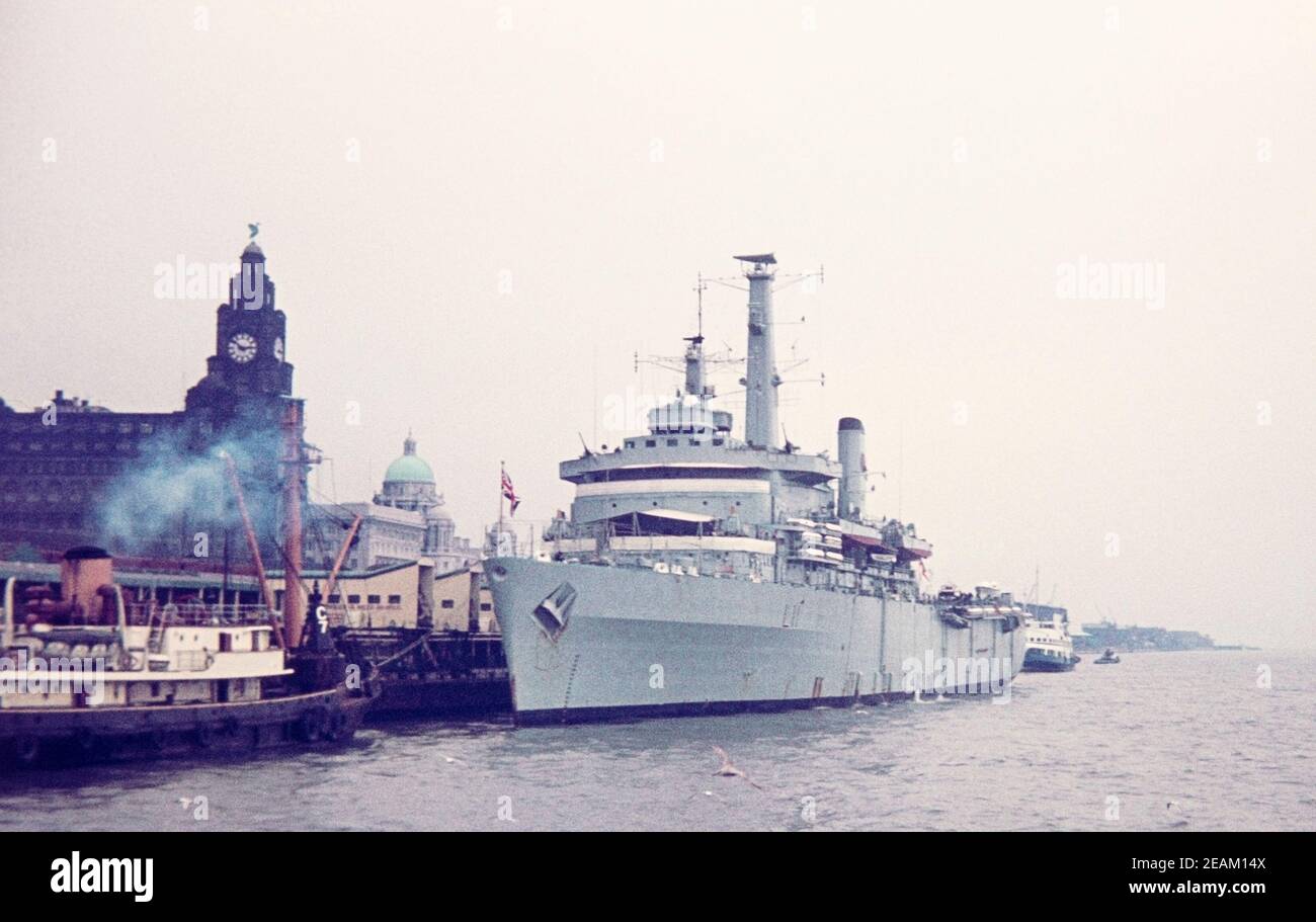 1973 Liverpool docks HMS Intrepid (L11) was one of two Fearless-class amphibious warfare ships of the Royal Navy, moored alongside the docks in front of the Liverpool Liver Building, River Mersey, Liverpool, Merseyside, England, GB, UK, Europe Stock Photo
