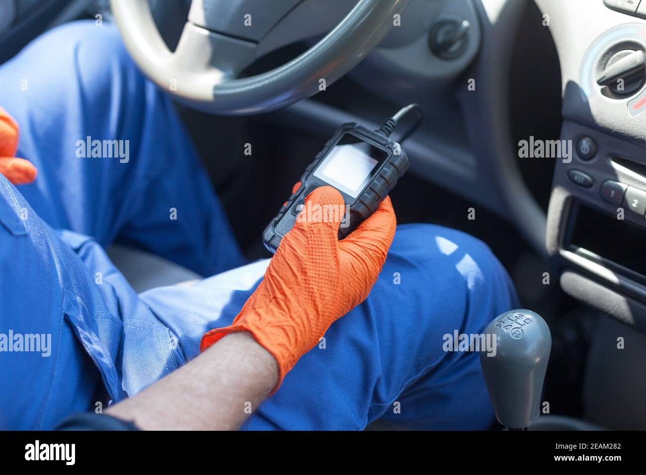 Auto mechanic using car diagnostic scan tool Stock Photo