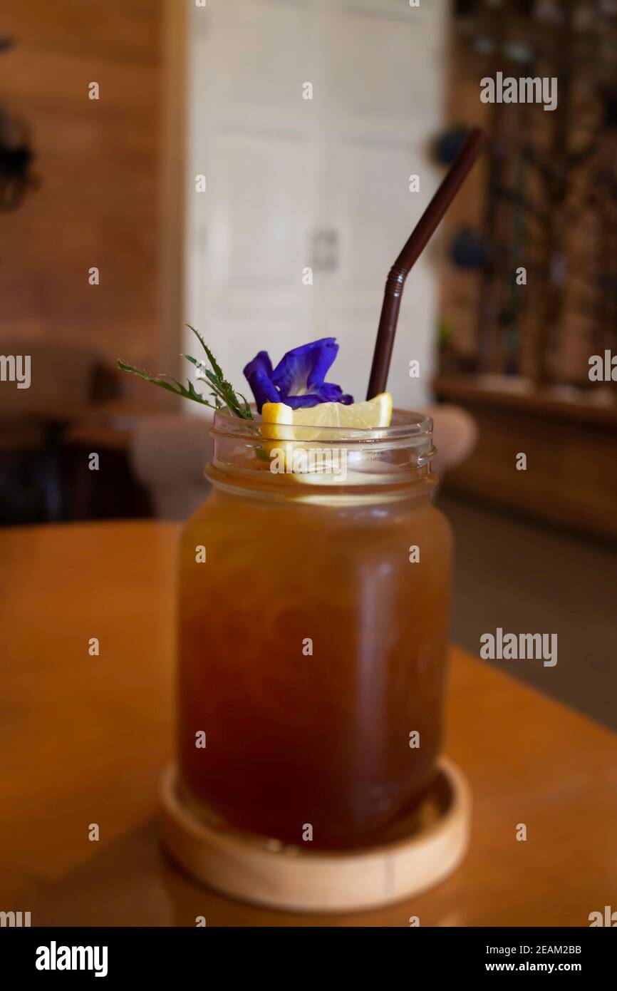 Glass of iced lemon tea with butterflypea drink Stock Photo Alamy