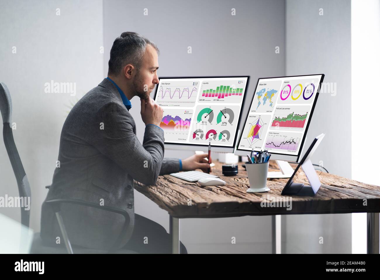 Financial Analyst Or Advisor Using KPI Data Technology Stock Photo