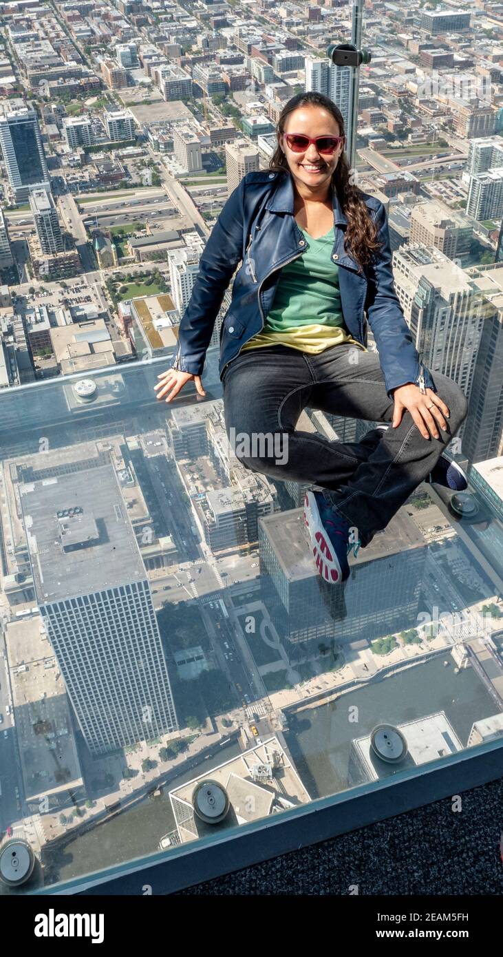 woman in glass box in Chicago Illinois Stock Photo Alamy