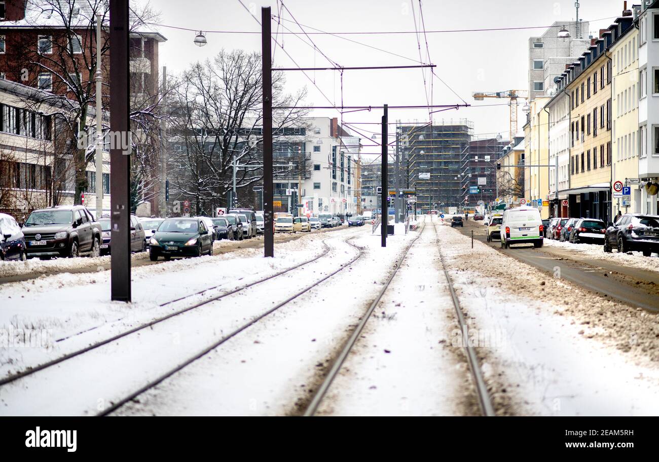 Hanover, Germany. 10th Feb, 2021. The snow-covered tracks of the city railway in Calenberger Neustadt are empty. Due to frost damage, the ÜSTRA Hannoversche Verkehrsbetriebe has suspended rail services throughout the city. Credit: Hauke-Christian Dittrich/dpa/Alamy Live News Stock Photo