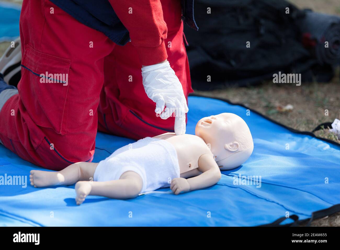Baby CPR dummy first aid training. Heart massage. Stock Photo