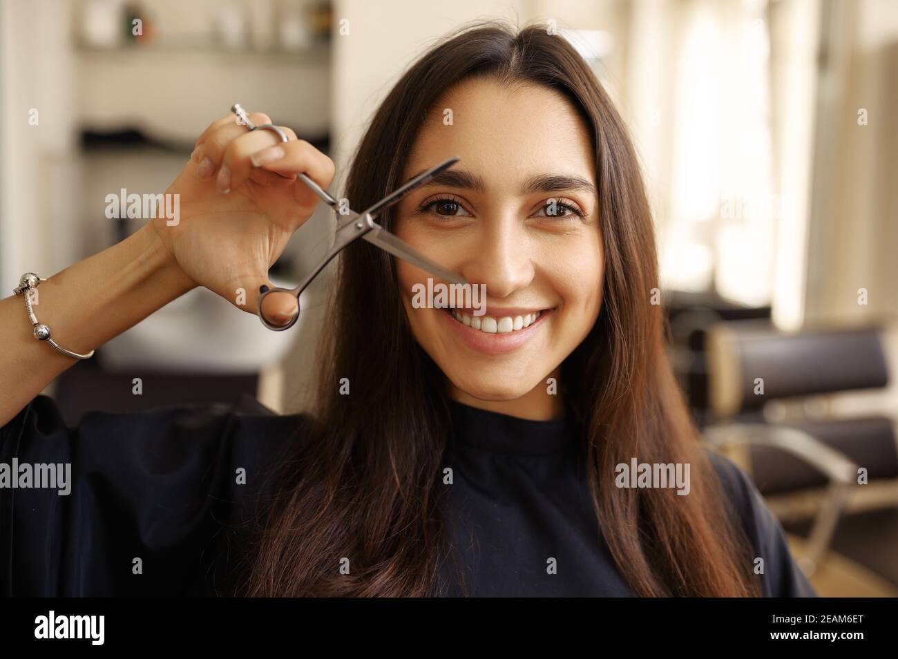 Female customer with sciccors, hairdressing salon Stock Photo Alamy