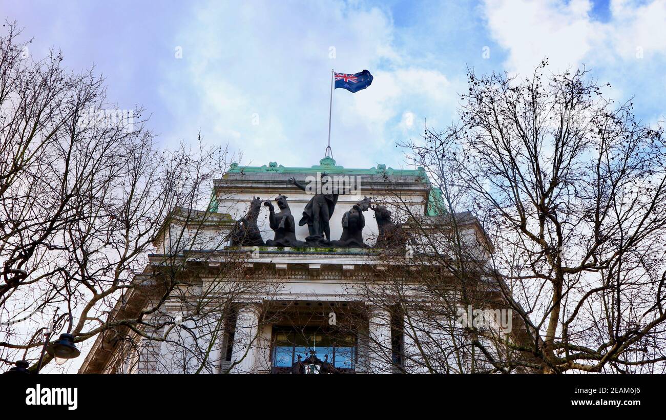 LONDON, UNITED KINGDOM - Feb 12, 2018: London, UK - January 2018: The Australia House with trees and cloudy sky. There are a flying Australian flag an Stock Photo