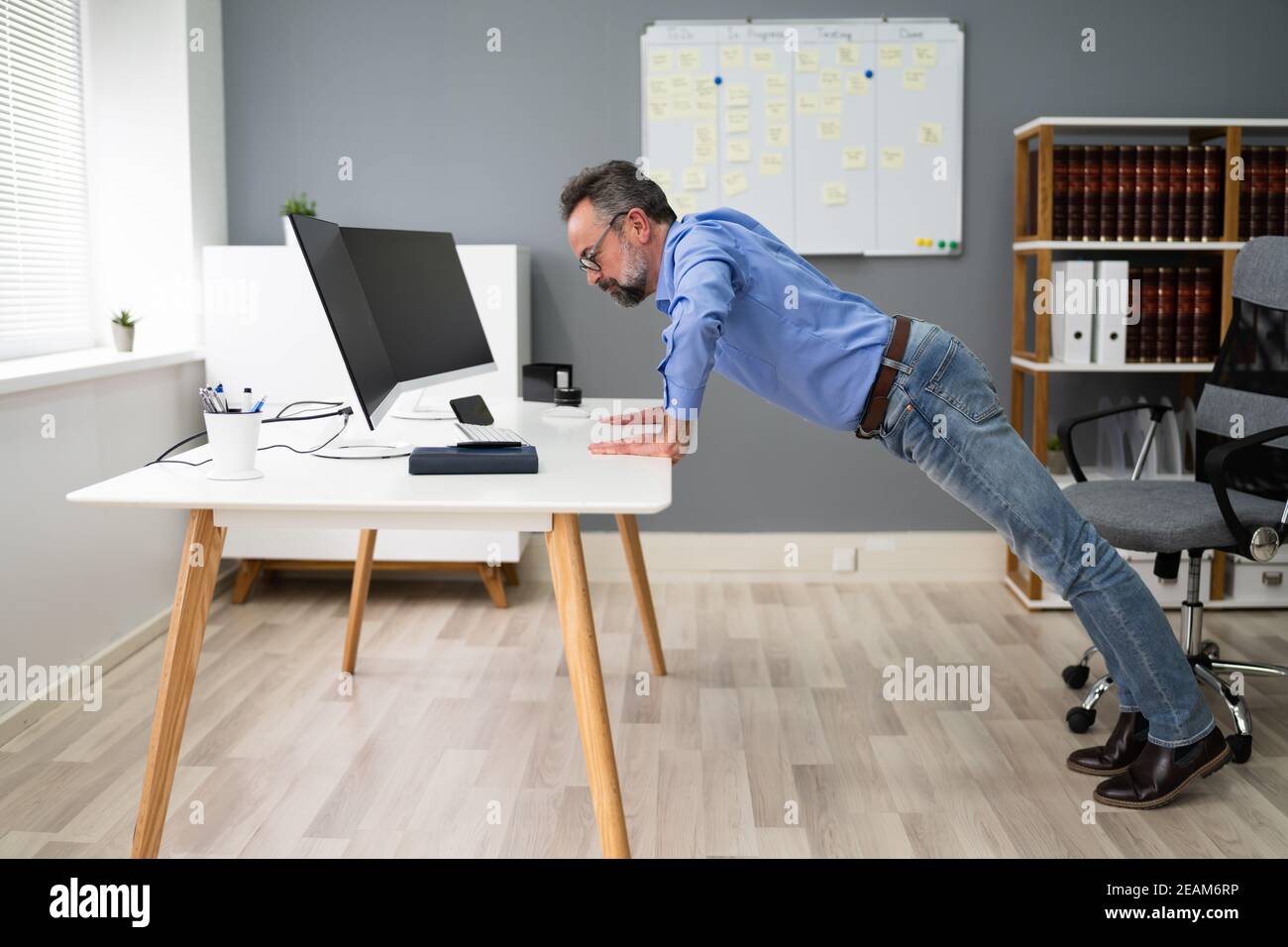 Office Workout Exercise. Push Up Stock Photo