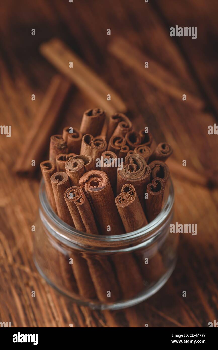 Cinnamon sticks in a glass jar Stock Photo Alamy