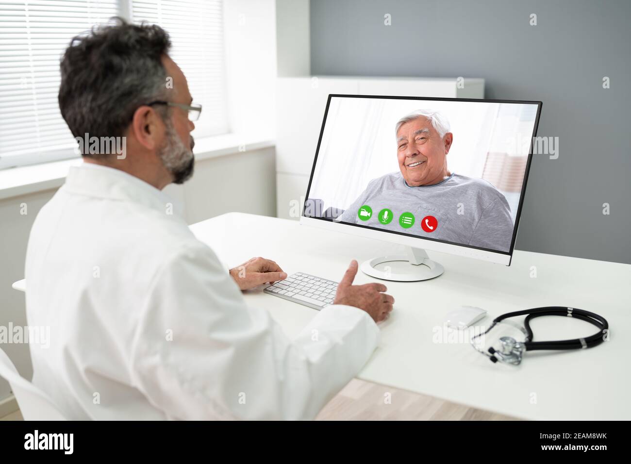 Doctor Talking With Patient Online In Video Call Stock Photo