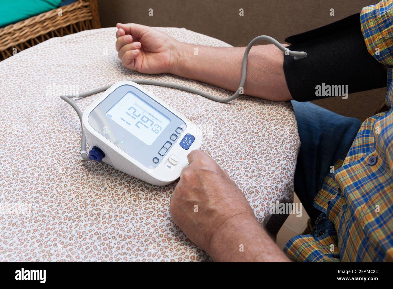 Blood pressure measure with heart rate check using digital device.  Healthcare and medical concept Stock Photo - Alamy
