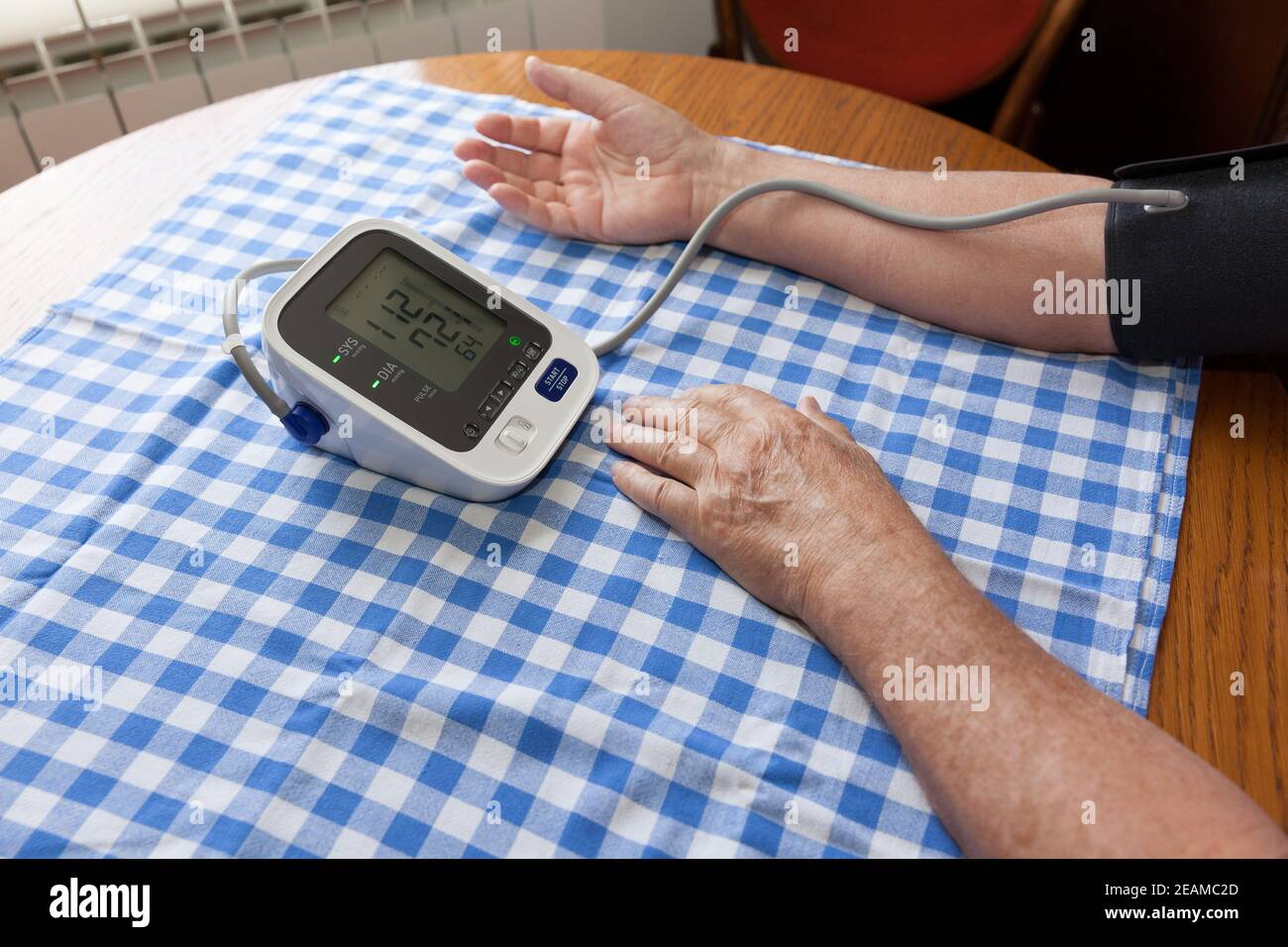 https://c8.alamy.com/comp/2EAMC2D/blood-pressure-measure-with-heart-rate-check-using-digital-device-healthcare-and-medical-concept-2EAMC2D.jpg