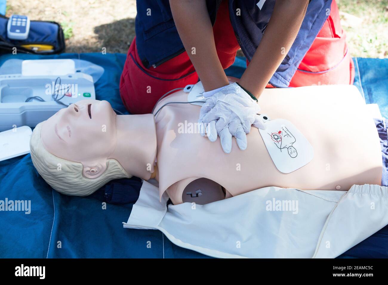 First aid and CPR training using automated external defibrillator device - AED Stock Photo