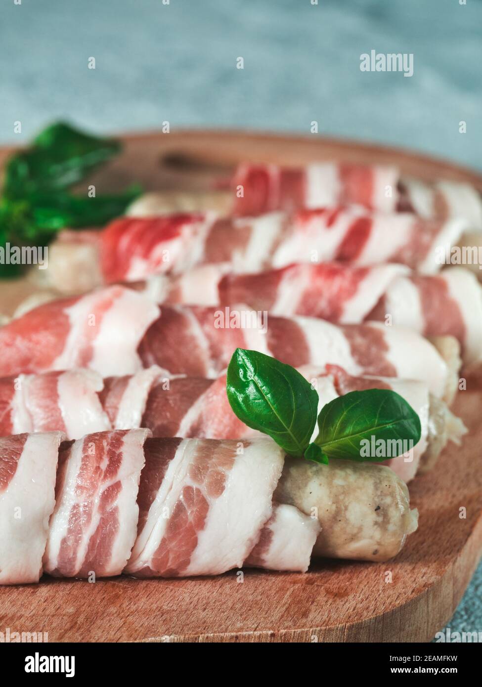 Sausages wrapped in bacon Stock Photo