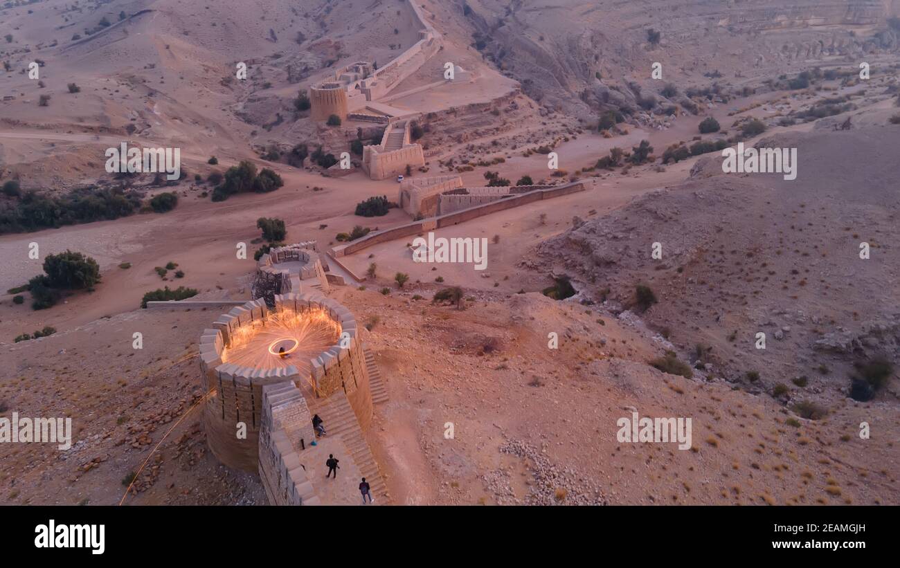 Steel wool light painting on Wall of Sindh Rani Kot at sunset time Stock Photo