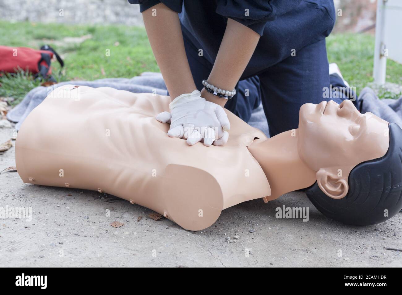 Paramedic demonstrates CPR on a dummy Stock Photo