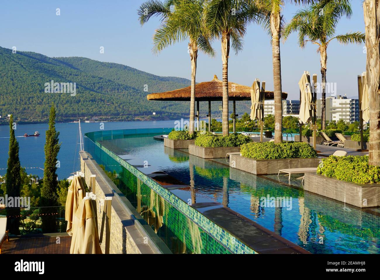 Bodrum Turkey August Beautiful Scenery Of Turkey Luxury Resort With Empty Swimming Pool In The Foreground Green Hills Palms And Azure Ocean Stock Photo Alamy