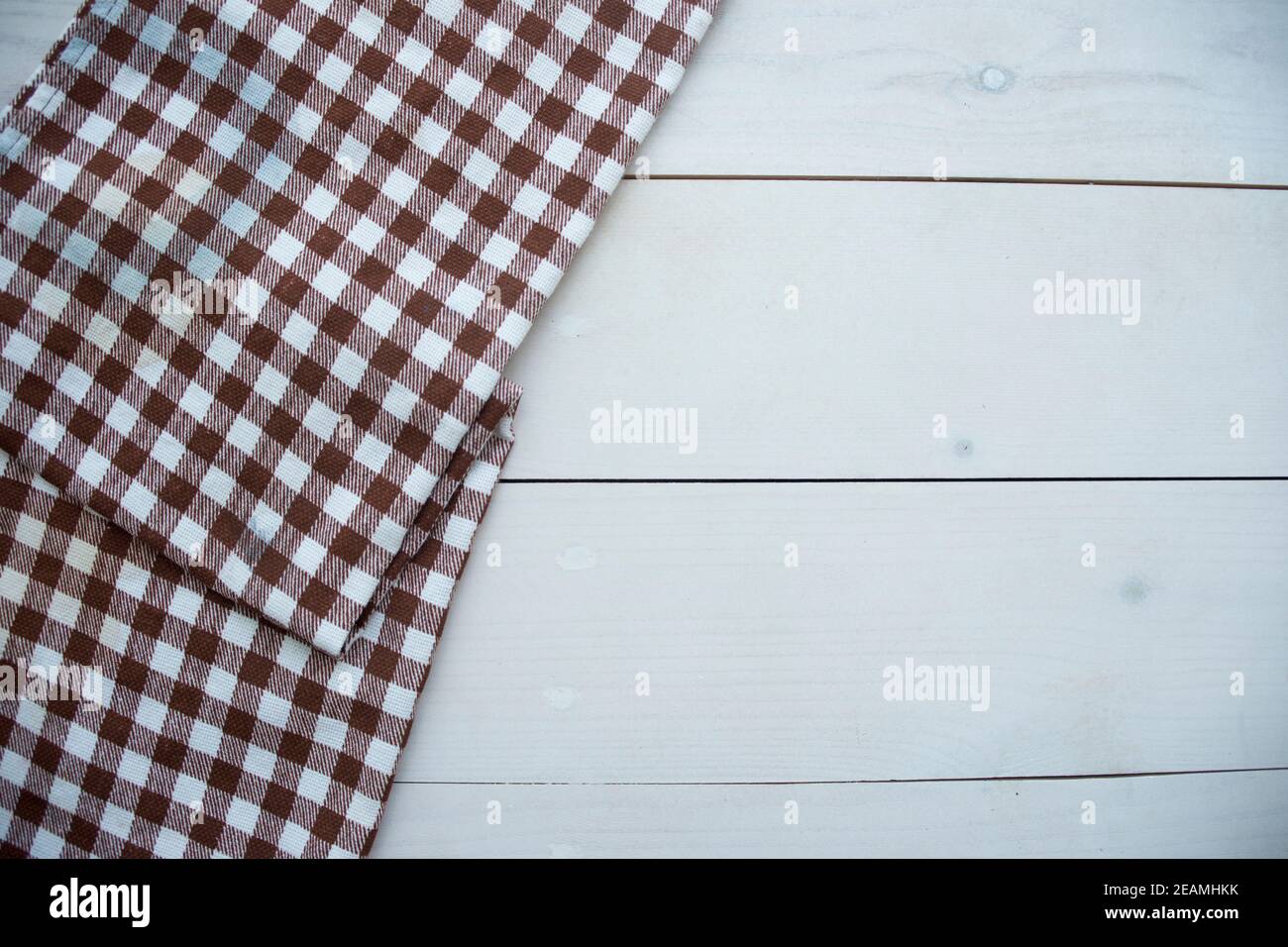 Wooden table covered with tablecloth cloth checkered Stock Photo