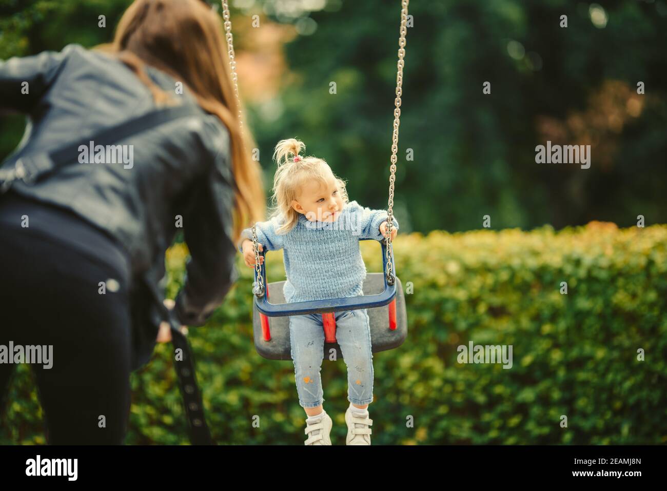 blonde haired girl on the swing Stock Photo - Alamy