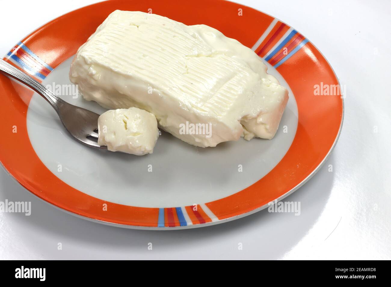 soft cheese stracchino spread on bread soft cheese stracchino spread on bread Stock Photo