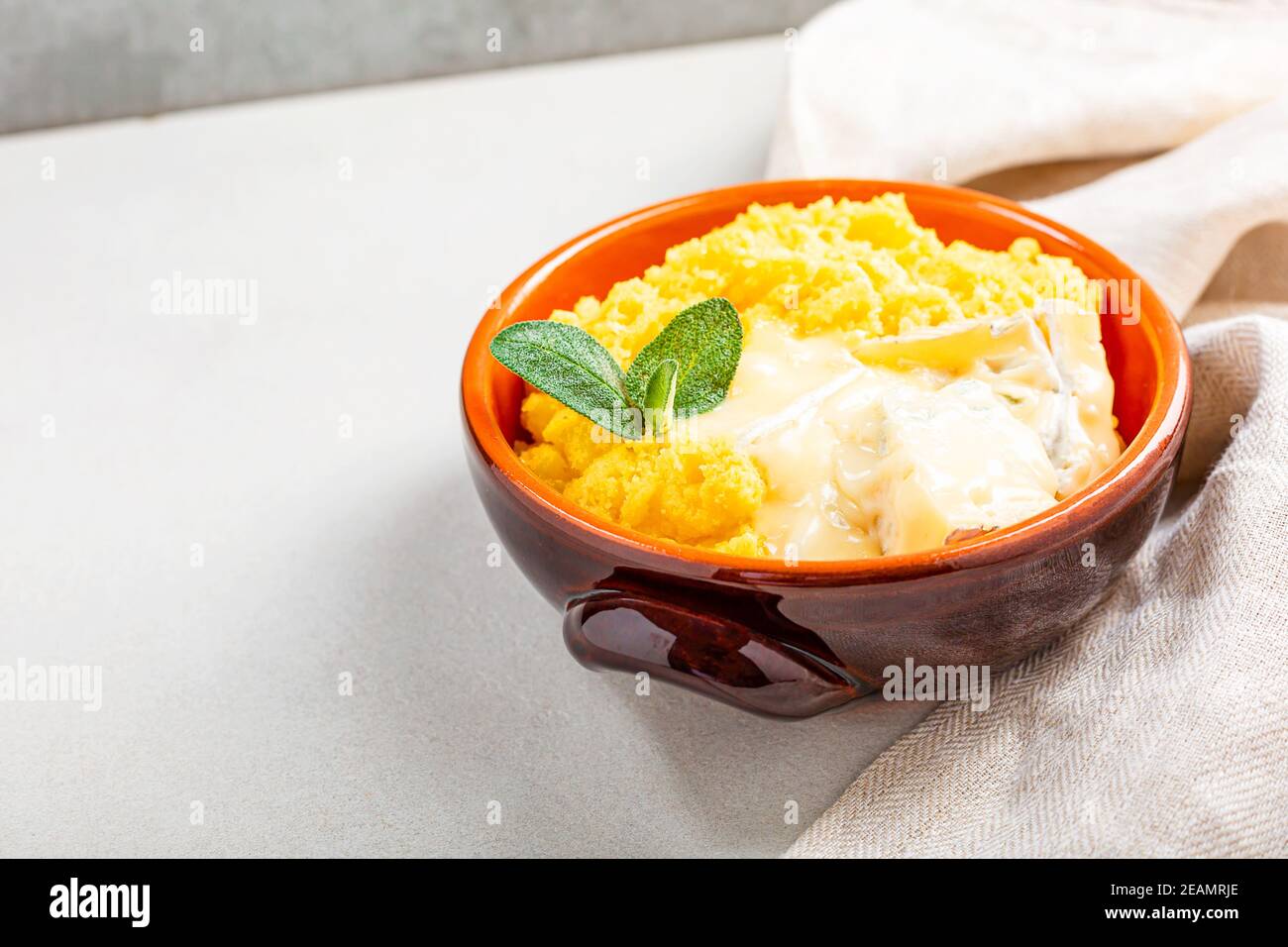 Dish of polenta with melted cheese Stock Photo Alamy